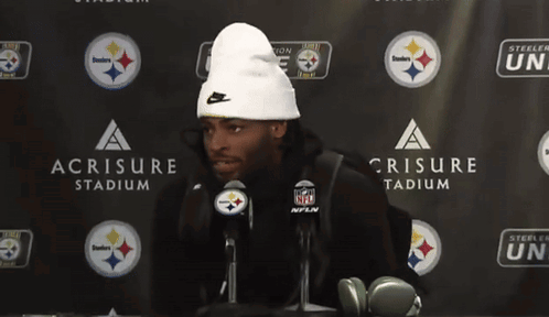 Man In White Beanie In Front Of Steelers Nation Unite Sign GIF