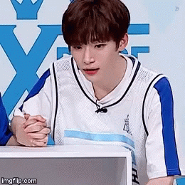 Man in White Blue Basketball Jersey Folded Hands