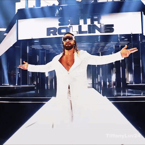 Man in White Coat and Sunglasses at Seth Rolling Sign