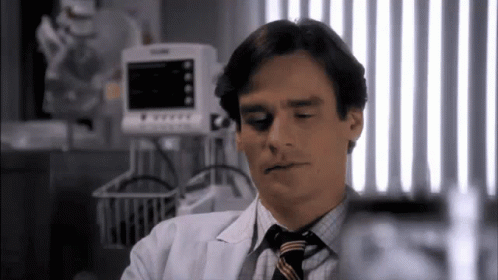 Man In White Coat And Tie At Monitor GIF