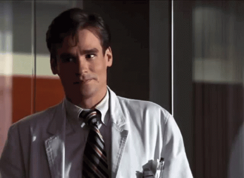 Man In White Coat And Tie Looking Left GIF