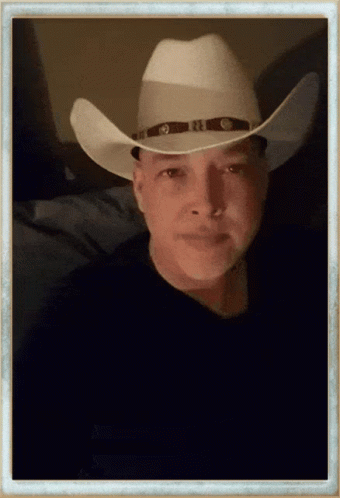 Man in White Cowboy Hat with Brown Band