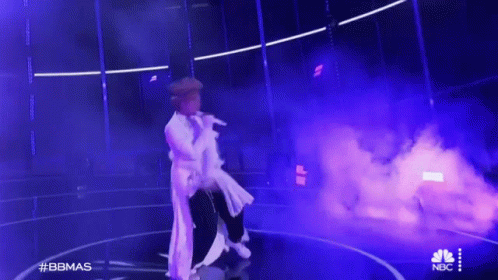 Man In White Dress Singing Stage Purple Smoke GIF