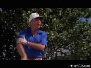 Man in White Hat and Blue Shirt on Golf Course