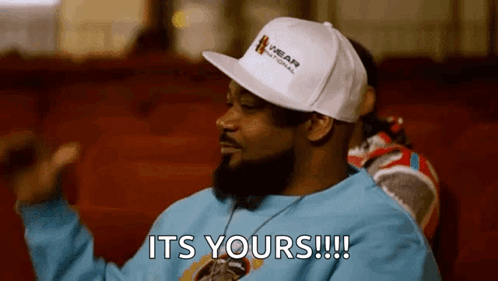 Man in White Hat Blue Shirt Saying It's Yours