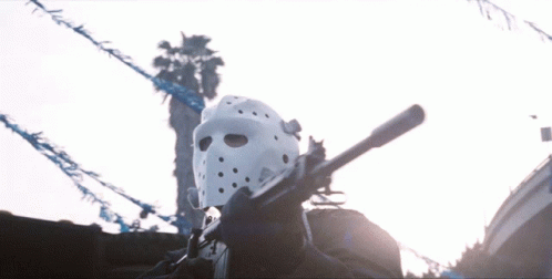 Man in White Hockey Mask Holding Gun