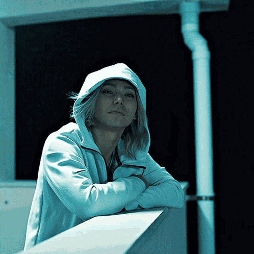 Man In White Hoodie Leaning On Wall GIF