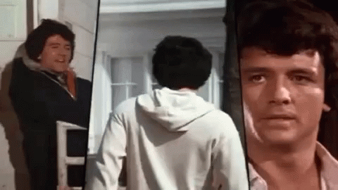 Man in White Hoodie Looking at Camera