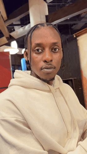 Man in White Hoodie Looks Serious