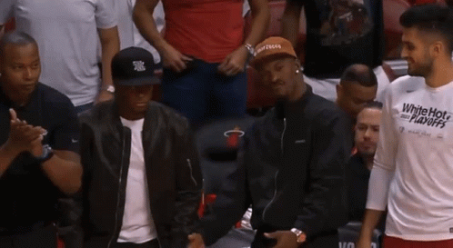 Man In White Hot Playoffs Shirt In Stands GIF
