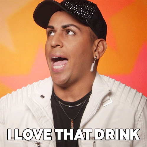 Man in White Jacket and Black Hat Says I Love That Drink