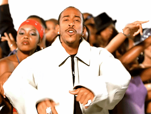 Man in White Jacket Dancing in Front of Crowd of Women