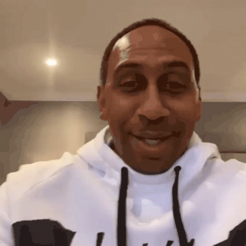 Man in White Nike Hoodie Smiling