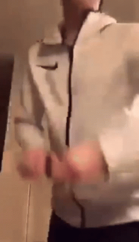 Man In White Nike Jacket Standing GIF