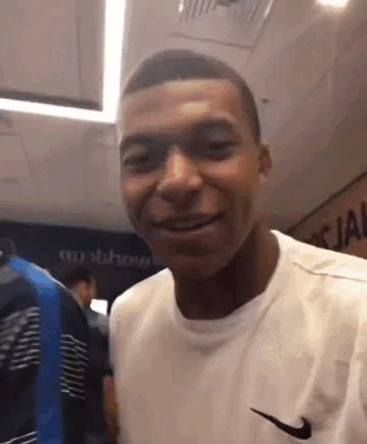 Man in White Nike Shirt Smiling