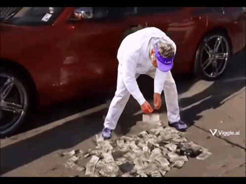 Man in White Pants and Purple Hat Standing on Money