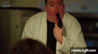 Man in White Robe Holding Gun Funny Face