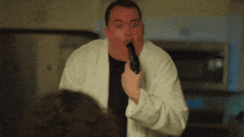 Man In White Robe Holding Gun In Mouth GIF