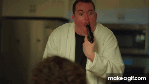 Man In White Robe Holding Gun GIF