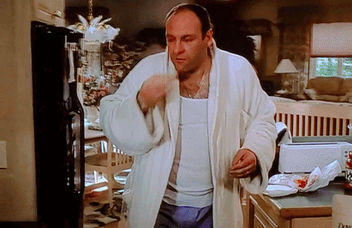 Man In White Robe In Front Of Dove Toaster GIF