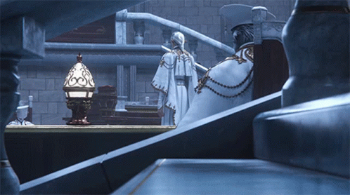 Man In White Robe Next To Woman In Cape GIF