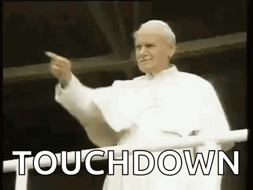 Man in White Robe Pointing
