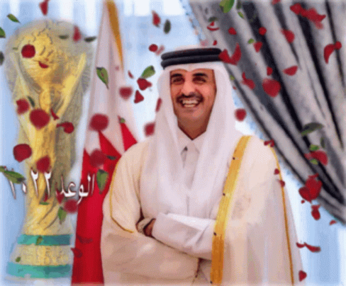 Man in White Robe Smiling at Trophy 2012