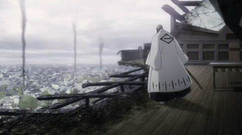 Man in White Robe With Diamond on Wooden Deck