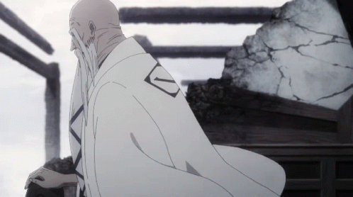Man in White Robe With Letter V