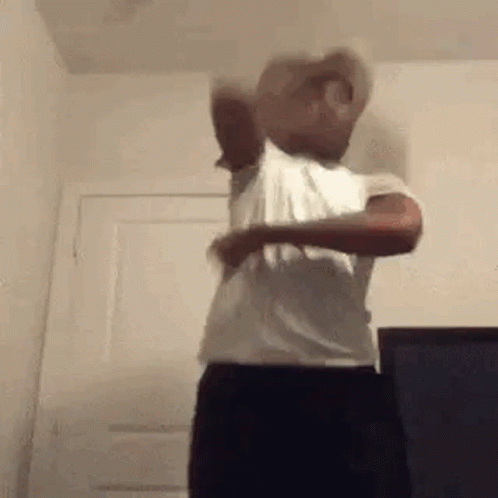 Man in White Shirt and Black Pants