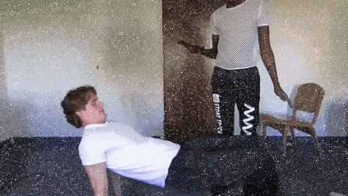 Man in White Shirt and Black Pants