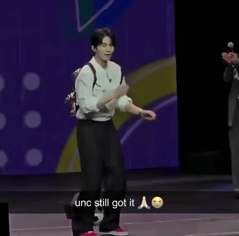 Man in White Shirt and Black Pants Dancing