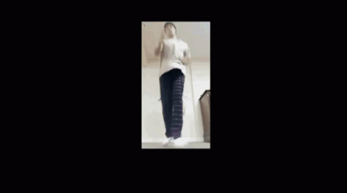 Man in White Shirt and Black Pants Dancing