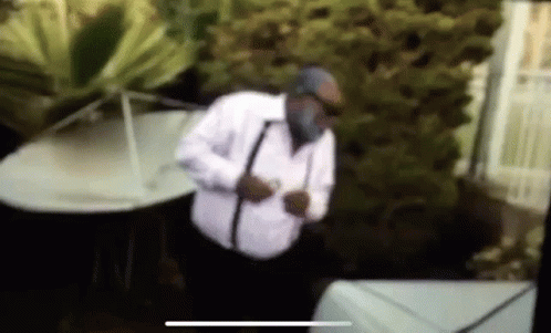 Man In White Shirt And Black Suspenders At Piano GIF