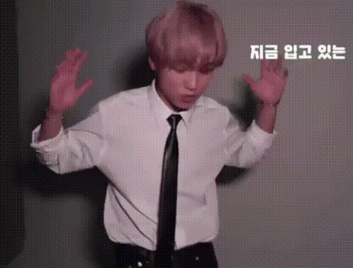 Man in White Shirt and Black Tie Dancing Hands in Air