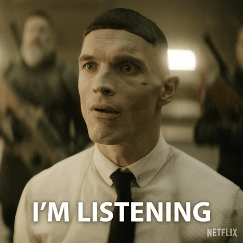 Man in White Shirt and Black Tie Says Im Listening Netflix
