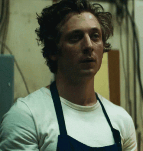 Man in White Shirt and Blue Apron