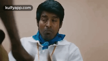 Man In White Shirt And Blue Scarf Looking GIF