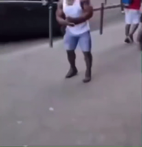 Man in White Shirt and Blue Shorts Crawling