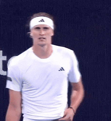 Man in White Shirt and Headband on Blue Background