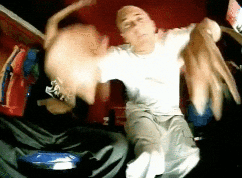 Man In White Shirt And Khaki Pants Dancing GIF