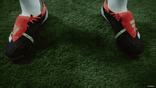 Man in White Shirt and Shorts on Soccer Field