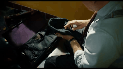 Man In White Shirt And Tie Holding Black Hat GIF