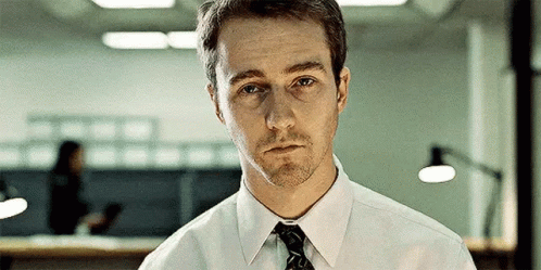Man In White Shirt And Tie Looking At Camera GIF