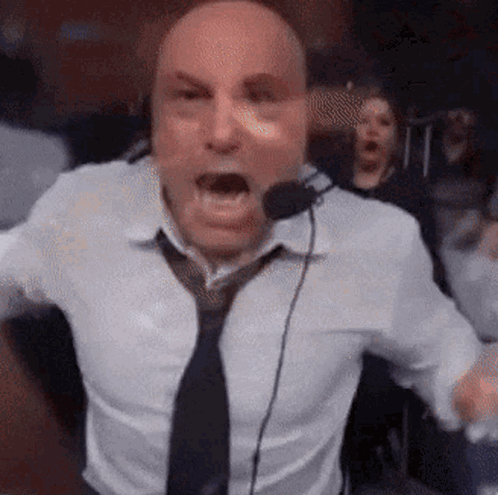 Man In White Shirt And Tie Screaming Into Microphone GIF