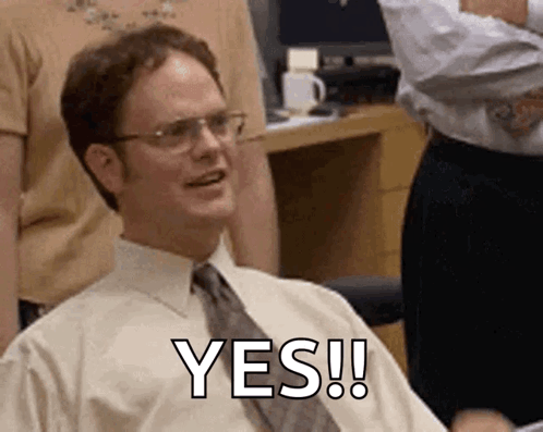 Man in White Shirt and Tie Smiling Saying Yes