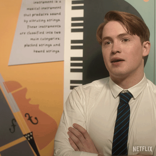 Man in White Shirt and Tie with Netflix Logo