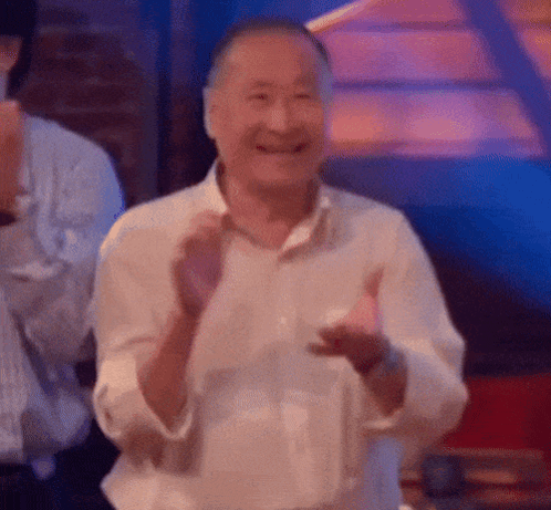 Man In White Shirt Applauding And Smiling GIF