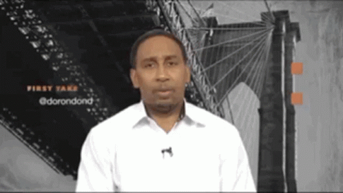 Man in White Shirt at Bridge Saying First Take