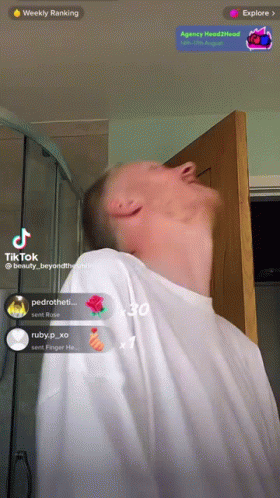 Man in White Shirt at Door with Weekly Ranking